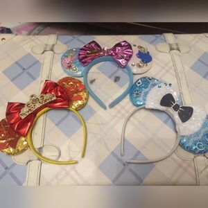 Three Micky Mouse Headbands Featuring Alice, Aurora And Bell